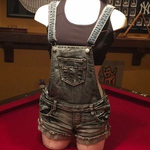 Adorable Vanilla Star Distressed Bib Overalls with Boho Interior Pattern.